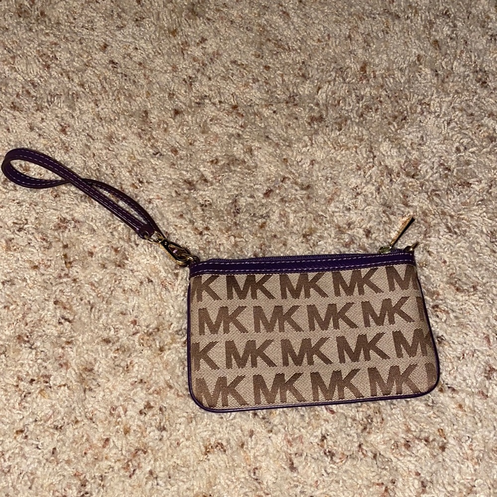 Purple and tan Michael Kors wristlet